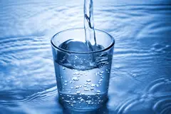 Water pouring into a glass